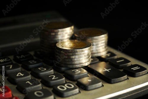 Stack of coins on black background, Saving money concept