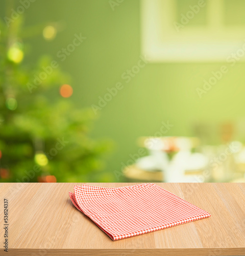 Red checked tablecloth on wood with christmas tree,decoration background