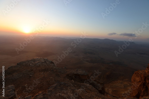 Sunrise on the shore of the Dead Sea in Israel. The sun rises from behind the mountains in Jordan. © shimon