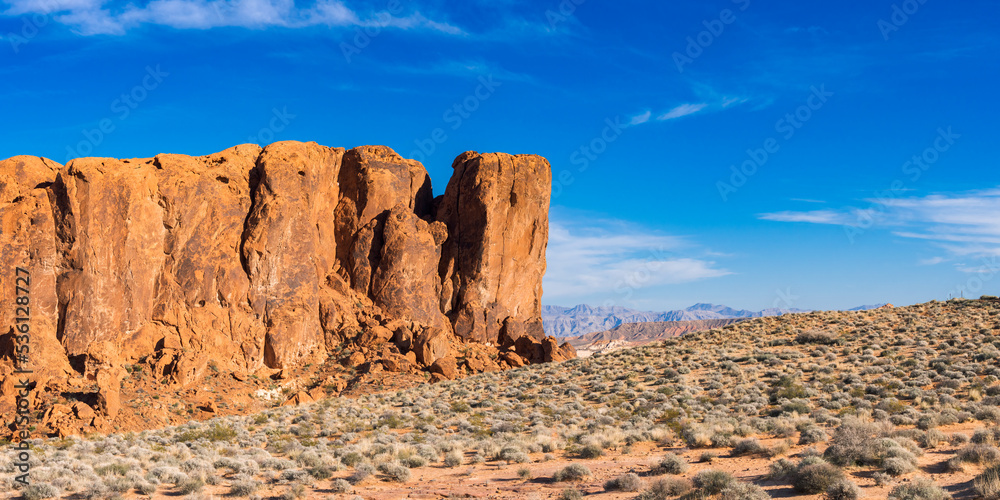 Rock Formation in Valley of Fire State Park Surrounded by a Desert Environment with Mountains in the Background, an Inhospitable Arid Climate