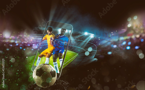 Fototapeta Naklejka Na Ścianę i Meble -  Watch a live sports event on your mobile device. Betting on football matches