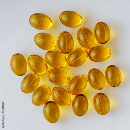 fish oil in omega 3 capsules on a white background