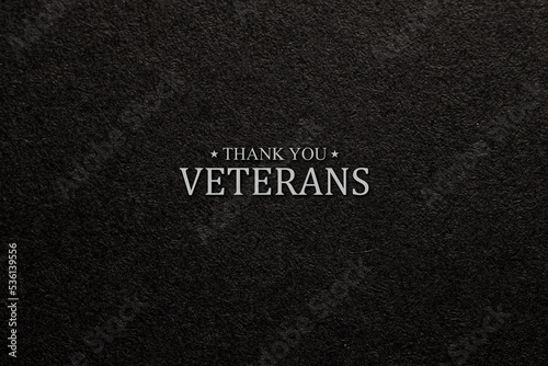 Text Thank You Veterans on black textured background. American holiday typography poster. Banner, flyer, sticker, greeting card, postcard.