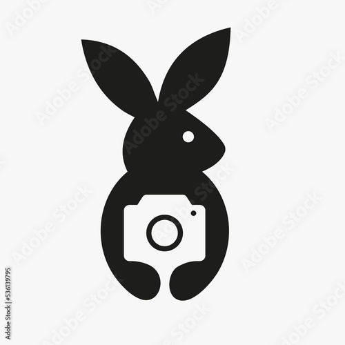 Rabbit Camera Logo Negative Space Concept Vector Template. Rabbit Holding Camera Symbol