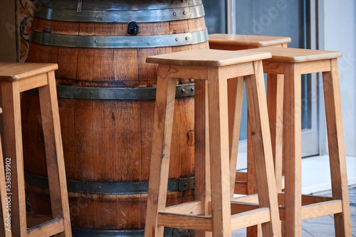 Stools and table on the terrace of a bar