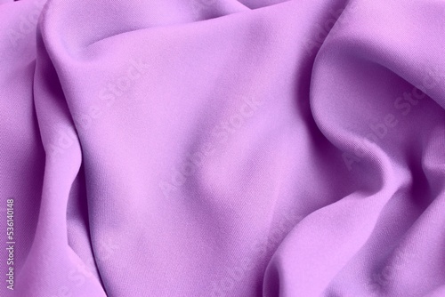 Plain light lilac fabric with beautiful pleats. Satin, linen, cotton or silk. Solid background.
