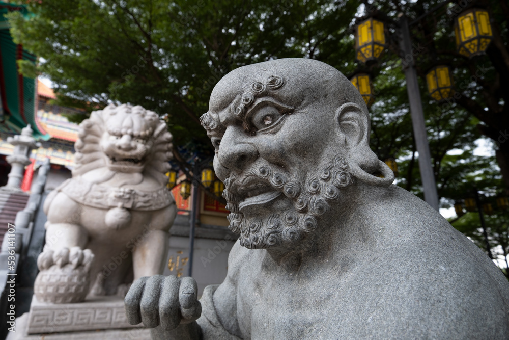 stone lion statue in the park