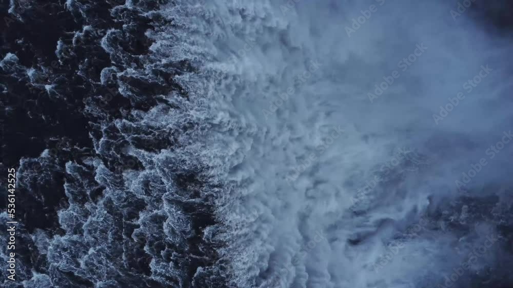 Waterfall on snowy cliff in winter Waterfall on snowy cliff in winter