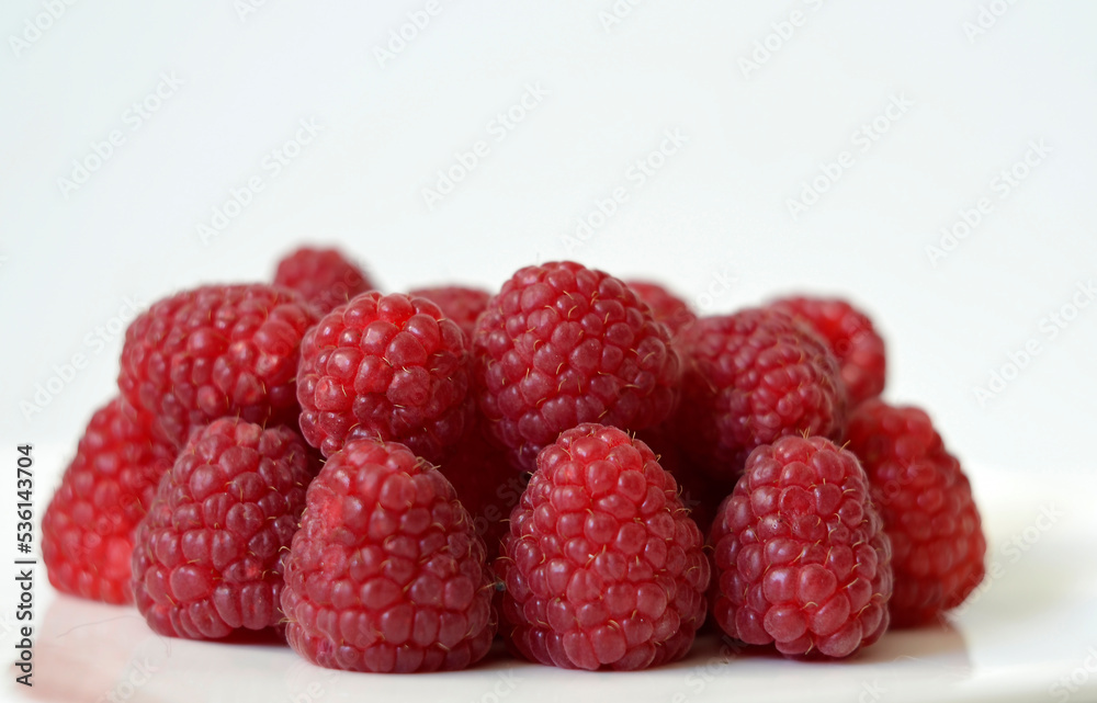 Fresh red raspberries on a white background Fresh red raspberries on a white background