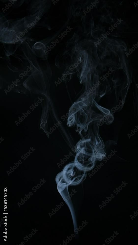 Slow motion vertical video of white smoke, fog, mist, vapor on a black background. Slow motion vertical video of white smoke, fog, mist, vapor on a black background.