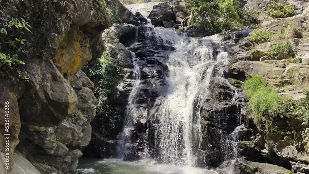 mountain waterfall on the island of sri lanka, sunny weather mountain waterfall on the island of sri lanka, sunny weather