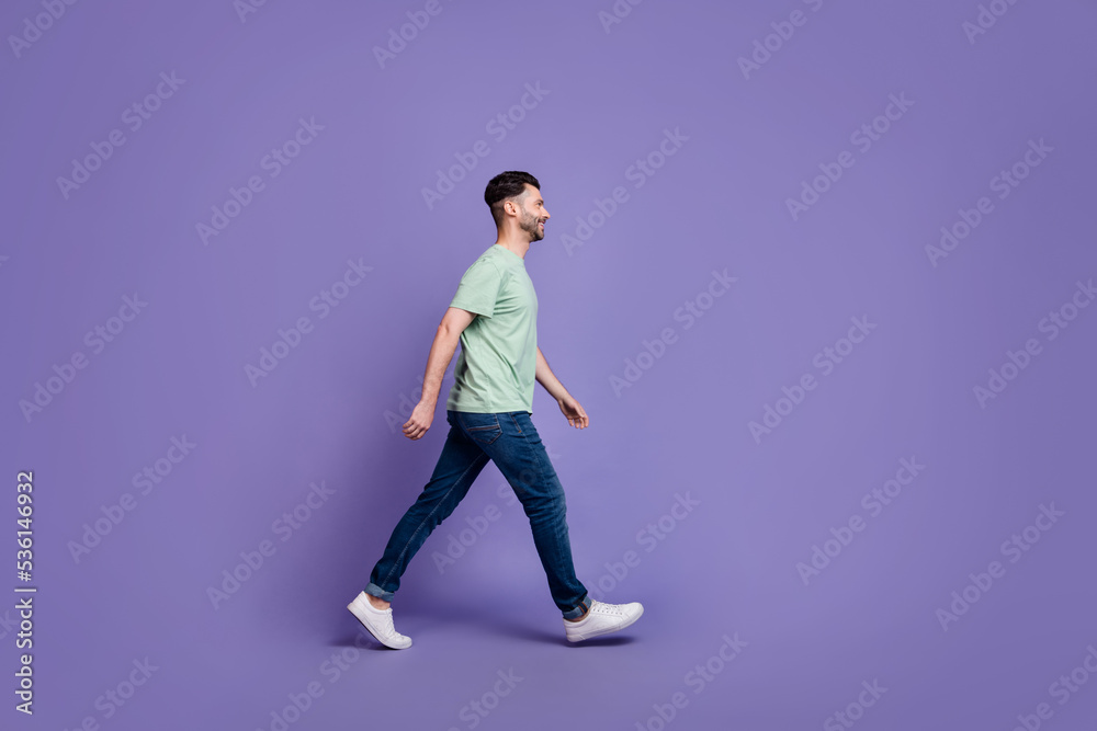 Full length profile side photo of cheerful man stylish clothes empty space hurry store black friday isolated on purple color background