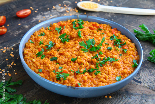 Red lentil dish with tomatoes and peppers. Vegetarian cooking
 photo