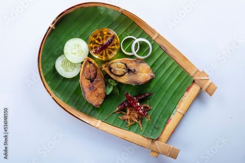 Ilish bhaji for Panta ilish, Bengali new year festive dish. Fried Hilsha slices with chilli, tomato and onion. Hilsa fry is popular in pohela boishakh. on kula.
