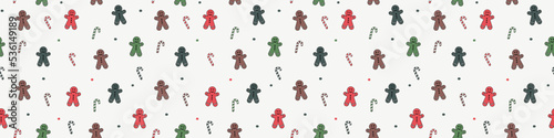 Christmas background with happy gingerbread cookies and candies. Seamless pattern. Banner. Vector