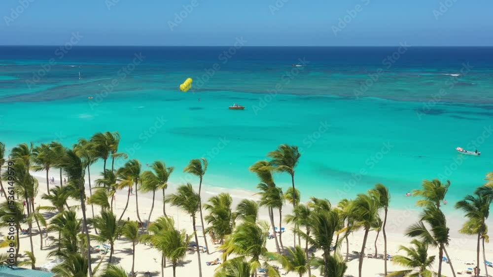 Pristine and bounty shore. Arena Gorda beach with resorts. People faving fun on caribbean coastline. Aerial view from drone