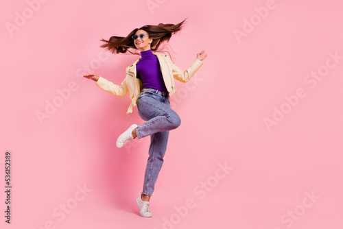 Full body photo of impressed brunette lady dance look promo wear casual cloth shoes glasses isolated on pink color background