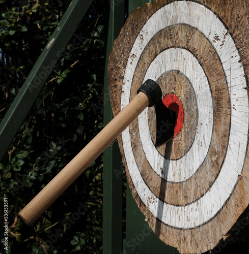 Throwing axe in bullseye of target