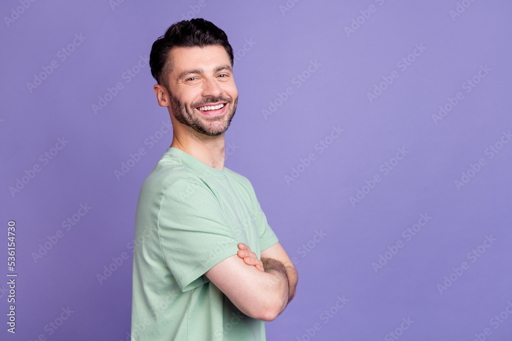 Photo portrait of nice young guy folded arms toothy beaming smile professinal wear trendy gray clothes isolated on violet color background Photo portrait of nice young guy folded arms toothy beaming smile professinal wear trendy gray clothes isolated on violet color background
