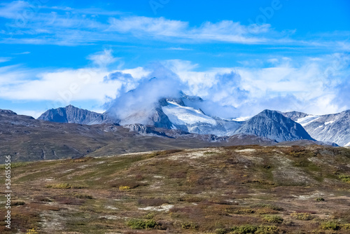 Yukon in Canada, mountains, wild landscape in autumn of the Tombstone park, the Dempster Highway, with a lake 