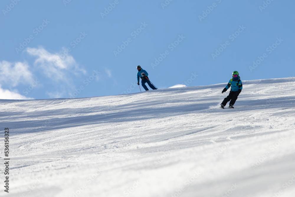 A child while skiing in a ski resort.