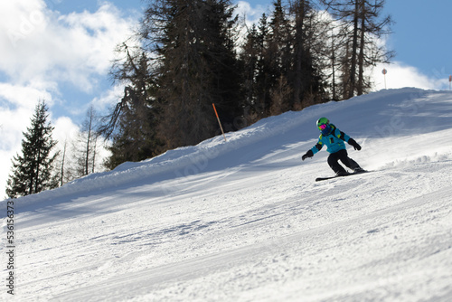 A child while skiing in a ski resort.