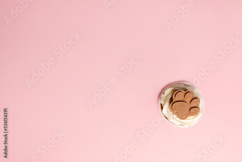 appetizing dog cupcake on a pink background. In honor of the dog's birthday. High quality photo