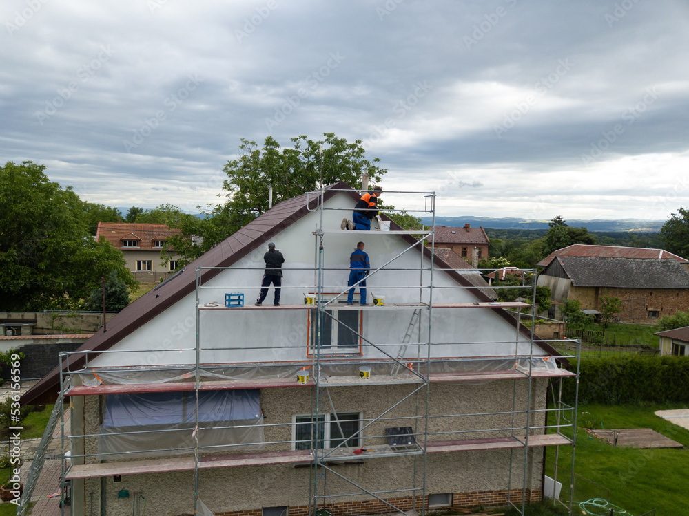 Aerial shot of thermal insulation of the facade of a family house.