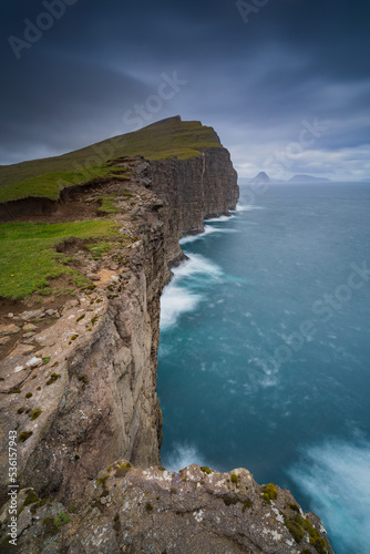 Trælanípan is one of the most renowned nature attractions in the Faroe Islands. From Trælanípan, in English the Slave Cliff, you can see the lake overlooking the salty North Atlantic ocean.