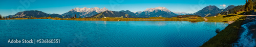 Fototapeta Naklejka Na Ścianę i Meble -  High resolution panorama with the famous Loferer and Leoganger Steinberge mountains in the background at Fieberbrunn, Tyrol, Austria