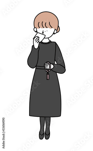 ハンカチで涙を拭く喪服のお姉さん白