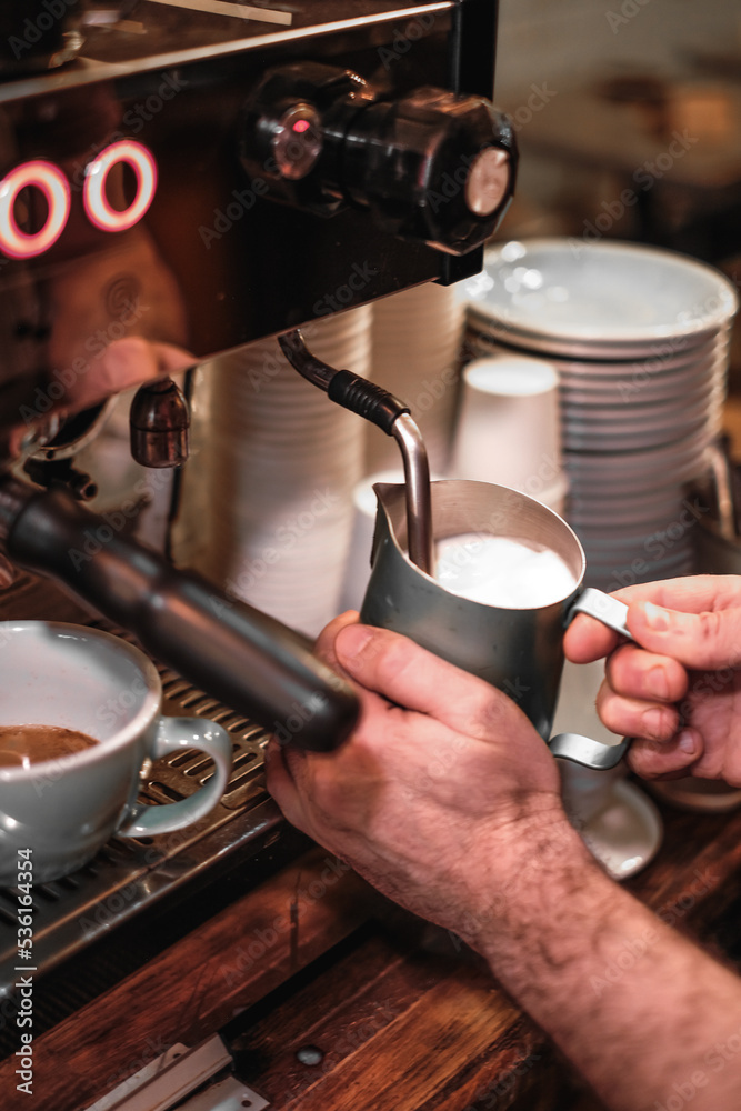 maker pouring coffee