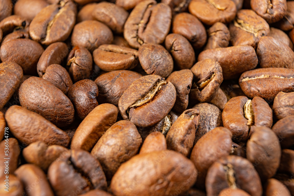 Coffee beans detailed on the background, aromatic coffee beans, place for inscription. Coffee beans detailed on the background, aromatic coffee beans, place for inscription.