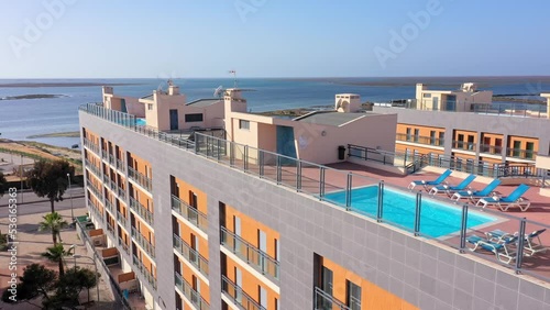 Aerial view of the urban area of portugal in the south of houses with modern infrastructure swimming pools overlooking the sea. Southern city of Portugal Olhao.