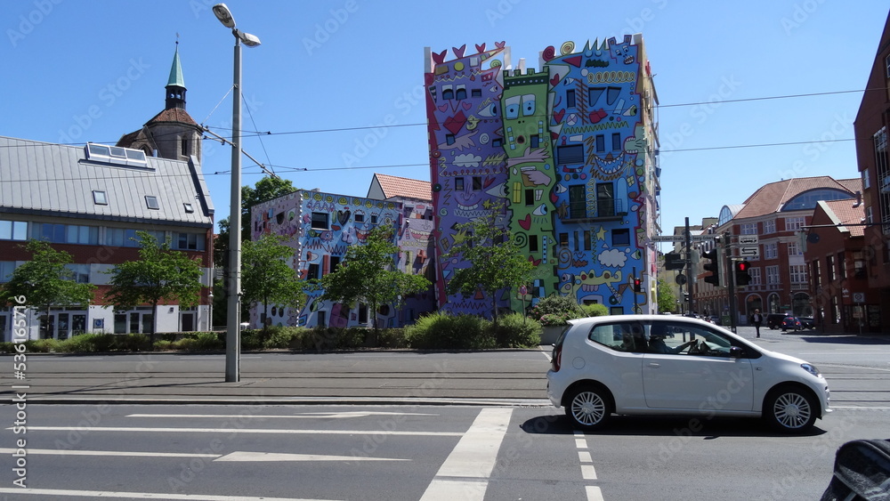 A colorful building, streetm cars, sky, happy rizzi house, blue at braunschweig, germany