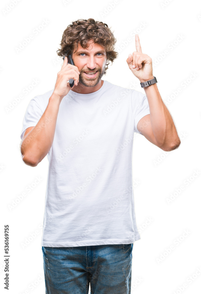 Handsome hispanic man model talking on smartphone over isolated background surprised with an idea or question pointing finger with happy face, number one Handsome hispanic man model talking on smartphone over isolated background surprised with an idea or question pointing finger with happy face, number one