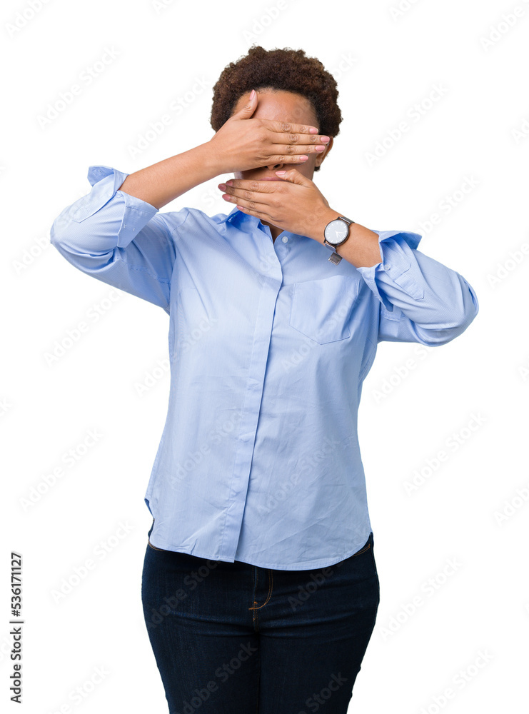Young beautiful african american business woman over isolated background Covering eyes and mouth with hands, surprised and shocked. Hiding emotion Young beautiful african american business woman over isolated background Covering eyes and mouth with hands, surprised and shocked. Hiding emotion
