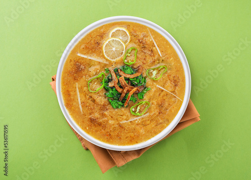 Top View Of Beef Haleem
green background. photo