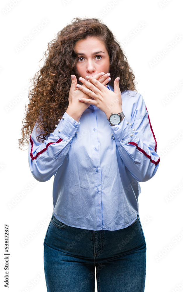 Beautiful brunette curly hair young girl wearing elgant look over isolated background shocked covering mouth with hands for mistake. Secret concept. Beautiful brunette curly hair young girl wearing elgant look over isolated background shocked covering mouth with hands for mistake. Secret concept.