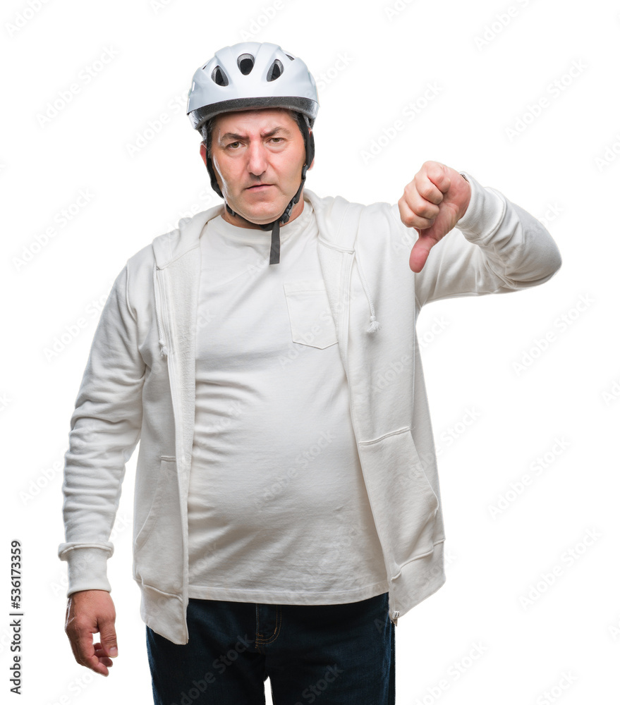 Handsome senior cyclist man wearing bike helmet over isolated background with angry face, negative sign showing dislike with thumbs down, rejection concept