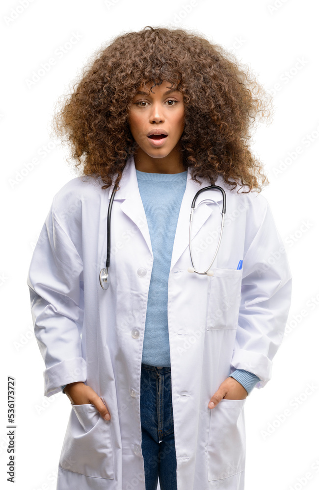 African american doctor woman, medical professional working scared in shock, expressing panic and fear African american doctor woman, medical professional working scared in shock, expressing panic and fear