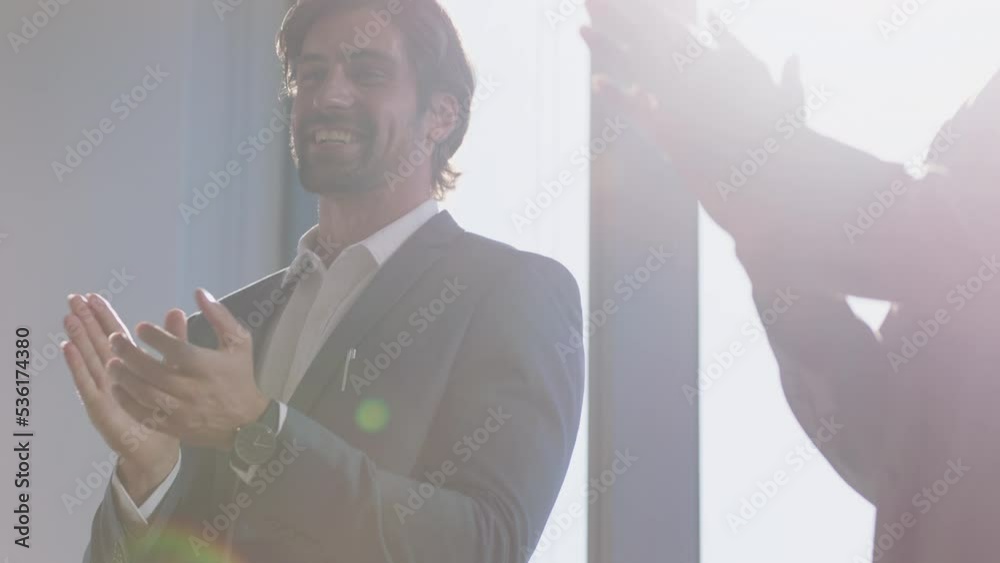 Hands, applause and support with a business man clapping for the goal, target or success of a colleague in the office. Teamwork, event and celebration with a male employee in solidarity with his team