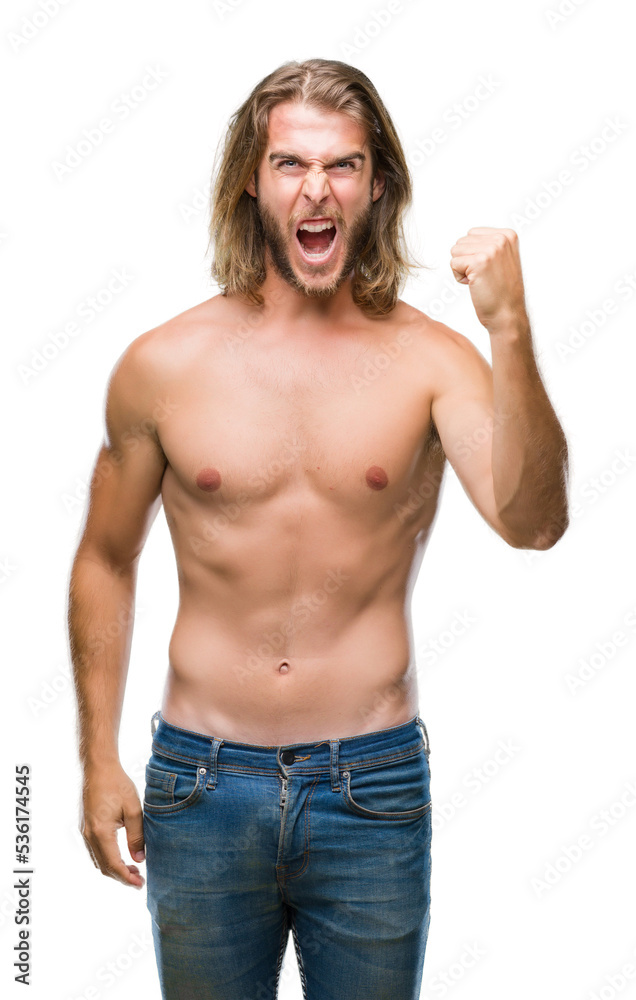 Fototapeta premium Young handsome shirtless man with long hair showing sexy body over isolated background angry and mad raising fist frustrated and furious while shouting with anger. Rage and aggressive concept.