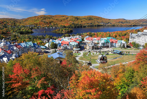 Lake and Mont Tremblant resort in autumn with cable car on the foreground, Canada