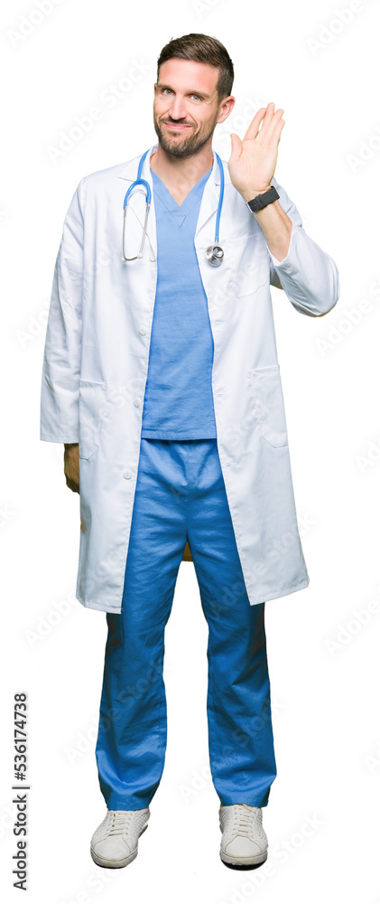 Handsome doctor man wearing medical uniform over isolated background Waiving saying hello happy and smiling, friendly welcome gesture Handsome doctor man wearing medical uniform over isolated background Waiving saying hello happy and smiling, friendly welcome gesture