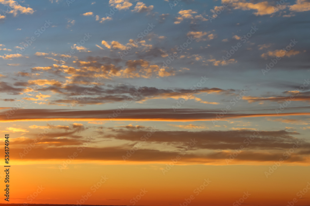Beautiful orange-blue sunset with clouds.