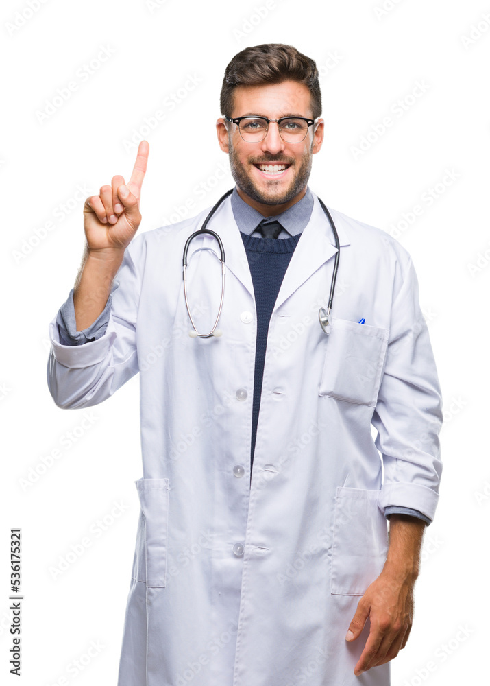 Young handsome doctor man over isolated background showing and pointing up with finger number one while smiling confident and happy. Young handsome doctor man over isolated background showing and pointing up with finger number one while smiling confident and happy.