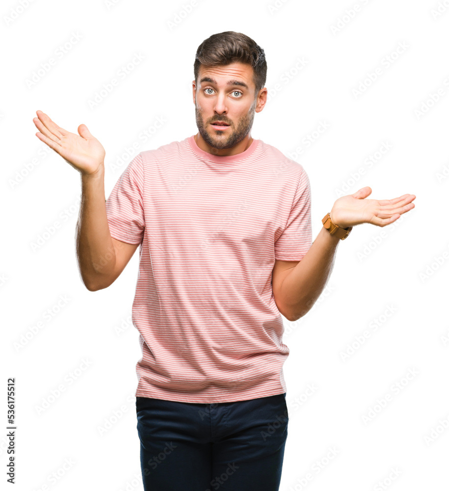 Young handsome man over isolated background clueless and confused expression with arms and hands raised. Doubt concept. Young handsome man over isolated background clueless and confused expression with arms and hands raised. Doubt concept.