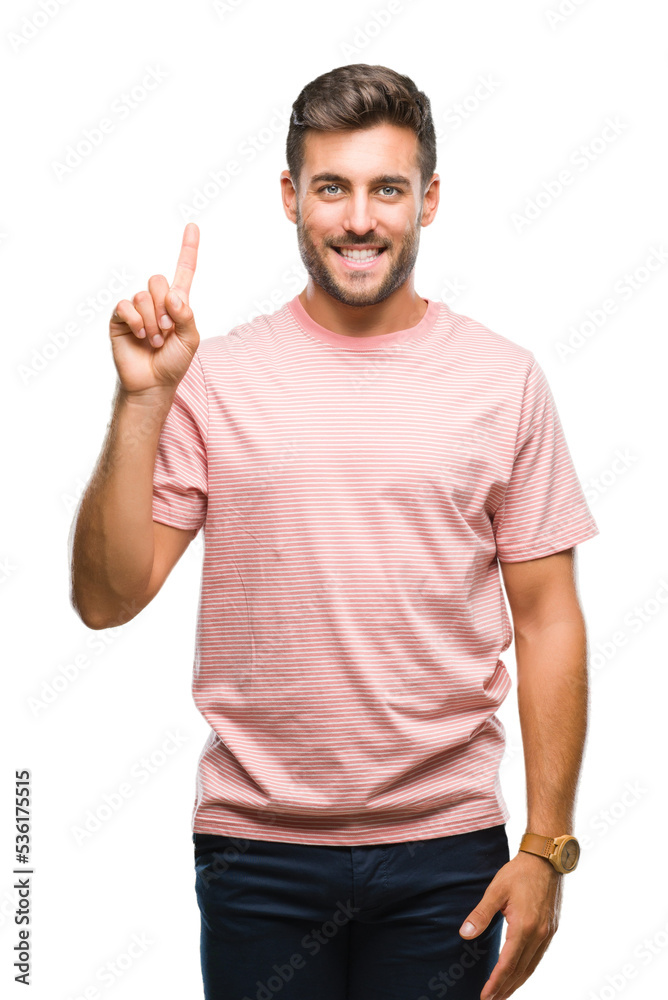 Young handsome man over isolated background showing and pointing up with finger number one while smiling confident and happy. Young handsome man over isolated background showing and pointing up with finger number one while smiling confident and happy.