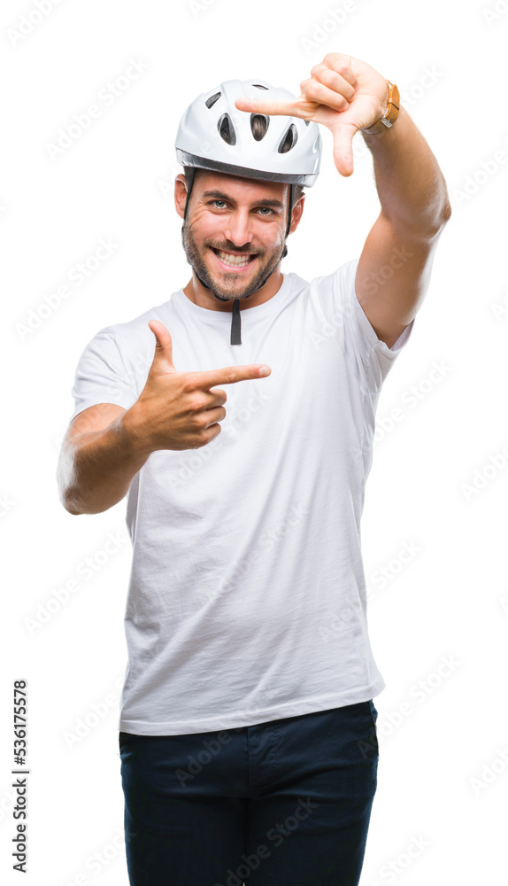 Young handsome man wearing cyclist safety helmet over isolated background smiling making frame with hands and fingers with happy face. Creativity and photography concept. Young handsome man wearing cyclist safety helmet over isolated background smiling making frame with hands and fingers with happy face. Creativity and photography concept.